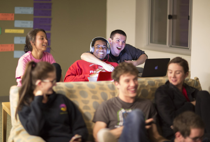 students relaxing in residence hall